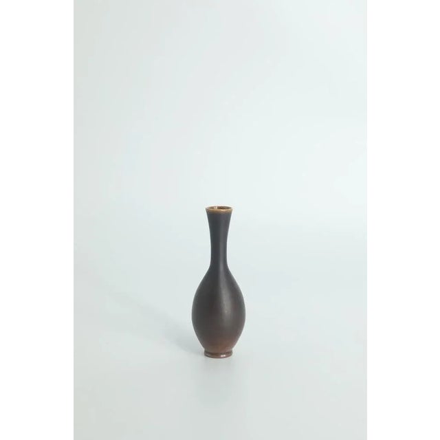 1. Height 8.5 cm | Width 2.5 cm | Depth 2.5 cm 2. Height 8 cm | Width 2.5 cm | Depth 2.5 cm This set of 2 miniature vases...