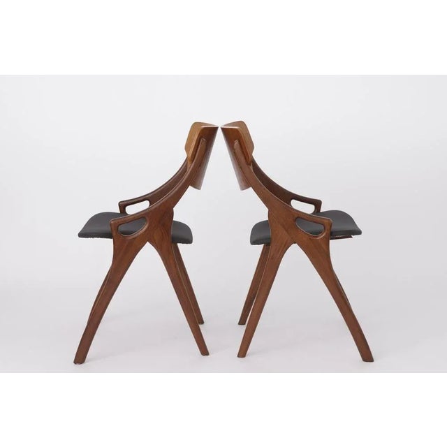 Pair of Arne Homvand Olsen dining chairs. Reupholstered with black skai material (artificial leather). Stable teak wood...