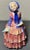 Up for sale is a 1932-1937 English Royal Doulton Porcelain Biddy Figurine (HN 1513) (Retired)! It measures 5 3/4” tall....