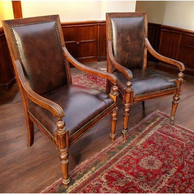 Elevate your study with this stunning pair of classic armchairs, blending timeless elegance with superior craftsmanship....