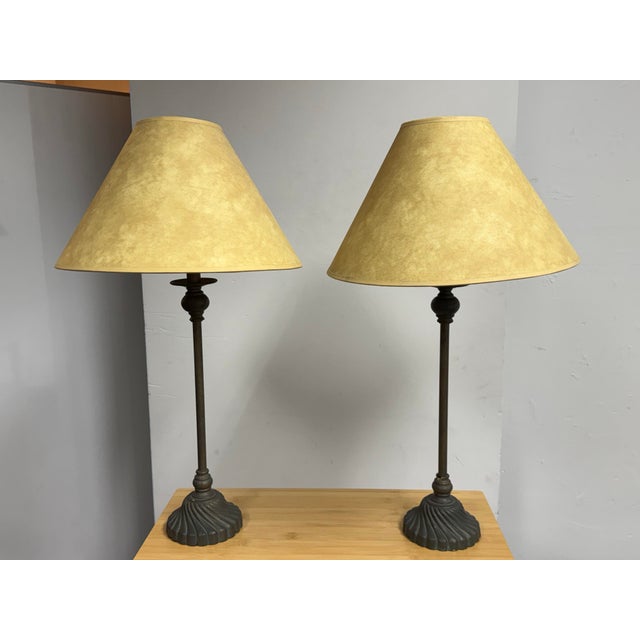 Design Plus Gallery presents a Pair of Traditional Table Lamps. Each lamp showcases a slender column stem supported by an...