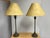 Design Plus Gallery presents a Pair of Traditional Table Lamps. Each lamp showcases a slender column stem supported by an...
