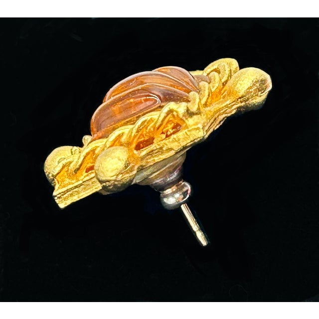 Fantastic vintage poured glass Gerard Yosca signed earrings. Amber colored curved glass in gold tone setting with rope...