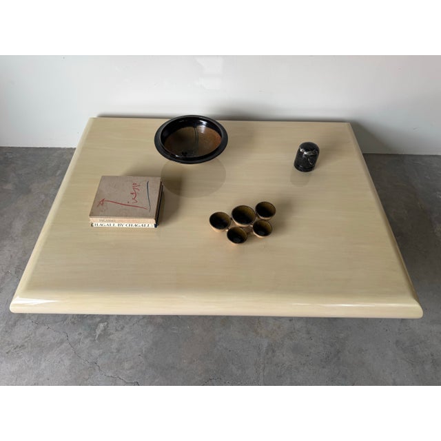 Striking large-scale coffee table designed in the iconic Karl Springer style, featuring a thick bullnose profile and a...