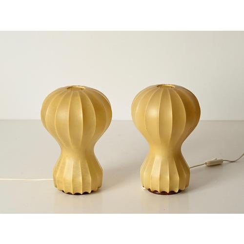 Stunning pair of first-edition gatto cocoon table lamps with a marvelous, uniform beige warm natural patina. These stylish...