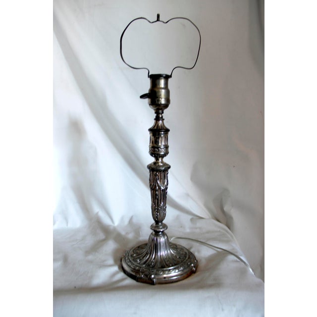 This is special. It is an antique table lamp that was made in France, converted from a silver plate candlestick in the...