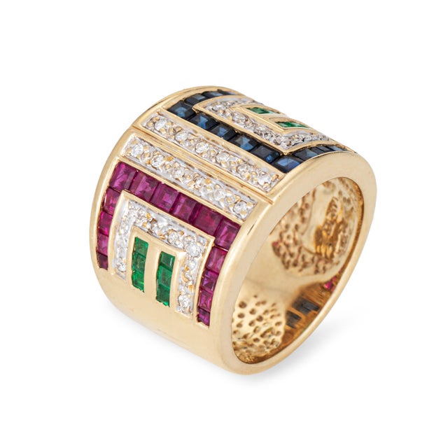 Stylish gemstone & diamond cigar ring (circa 1970s to 1980s) crafted in 14k yellow gold. 28 diamonds total an estimated...