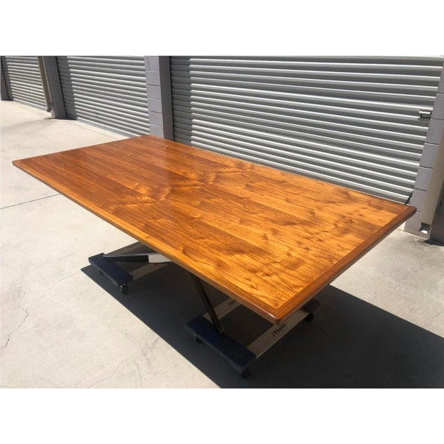 This table is in the Manner of Florence Knoll Mid Century Modern Chrome Dining Conference Table is a stylish and modern...