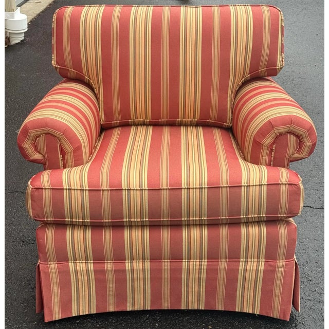 Beautiful upholstered chair by Masterfield furniture. Features a striped upholstery in tan and salmon, rolled arms, loose...