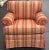 Beautiful upholstered chair by Masterfield furniture. Features a striped upholstery in tan and salmon, rolled arms, loose...