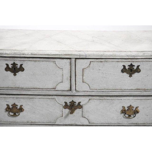 Very fine scandinavian chest, with original hardware and iron handels in the sides, richly carved, 18th c.h. 96 w. 115 d....