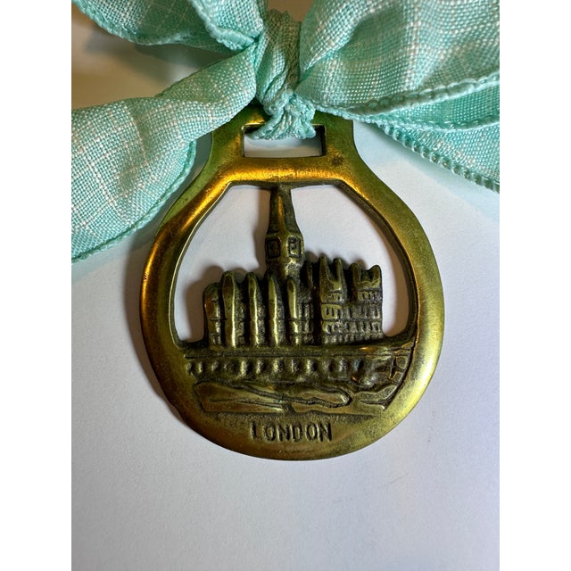Bring a touch of whimsy to your holiday season with our delightful Antique English Tower of London Brass Ornament....