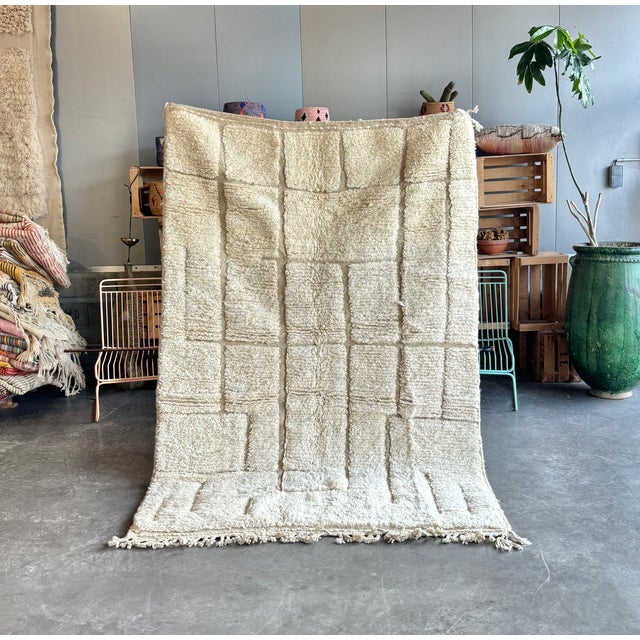 # Moroccan Beni Ouarain Rug – Sculptural Geometric Wool Rug – Handmade Berber Design This exceptional Moroccan Beni...