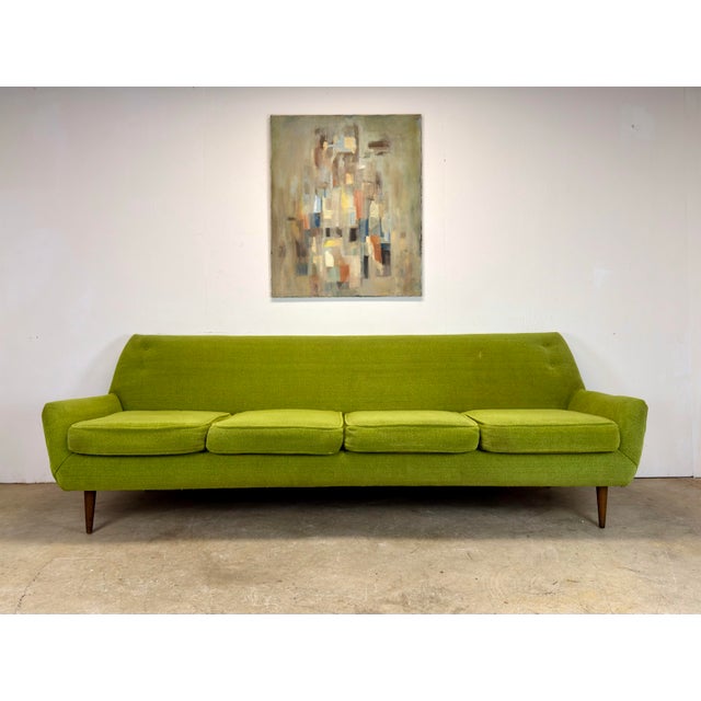 A fabulous mid century modern 4-seat sofa in vivid period chartreuse fabric. Looks Danish in the style of Dux / Folke...