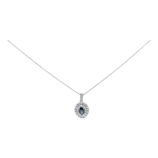 14K White Gold Oval Blue Sapphire and 3/4 Cttw Diamond Halo Pendant Necklace For Sale