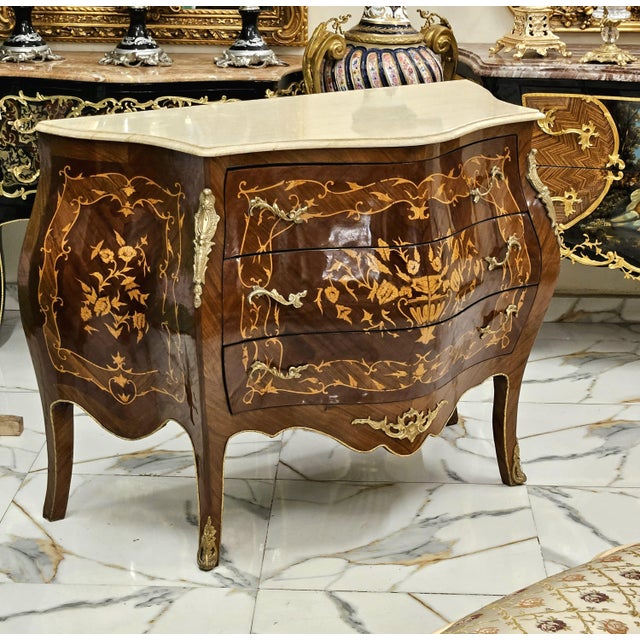 Bring refined European elegance to your home with this exquisite French-inspired commode, featuring a rich brown wood...