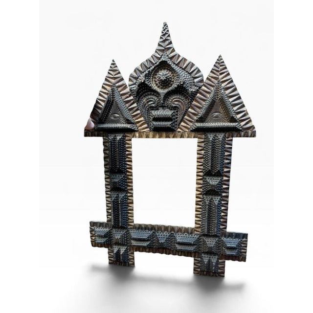 An exceptional tramp art frame dating to circa 1880–1900, built up in roughly six stacked layers of chip-carved wood. The...