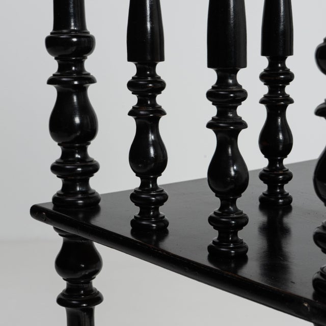 A 19th century French étagère from the Napoleon III period, crafted in wood with a black patinated finish and open...