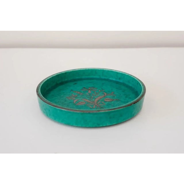 An Art deco Swedish deorative plate known as "Argenta" designed by Wilhelm Kåge and handmade for Gustavsberg in the 1930s....