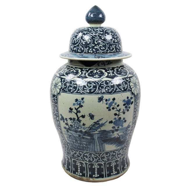 This gorgeous 35 inch high large blue and white porcelain jar is adorned with beautifully hand painted landscape and...