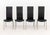 Set of Eight Modern Black Leather Dining Chairs, each with high back and geometric design metal base. 41" H x 18.5" W x...