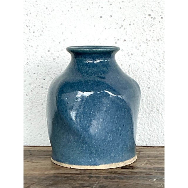 This striking vintage studio pottery vase is a masterclass in organic minimalism and artisanal craft. Hand-thrown with a...