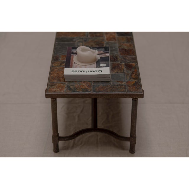 Unique handcrafted French mid century coffee or side table dating from the 1960s. The table features a beautifully forged...