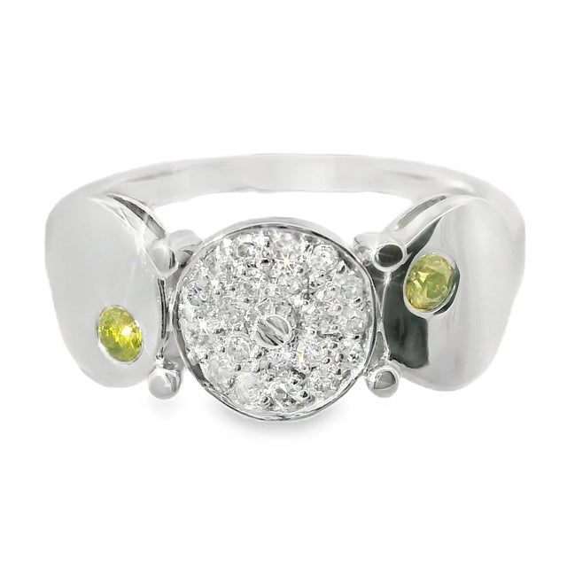 14K White Gold Yellow Diamond Ring. This beautiful piece features 2 brilliant round yellow diamonds, complemented by 18...