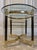 Vintage Hollywood Regency Modern brass and glass Table. Good vintage condition There is no signature or mark on this...