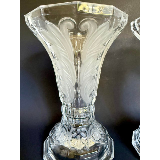 Here is a pair of vintage reversible glass vases and candleholders featuring a substantial faceted form with elegant...