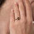This elegant vintage diamond engagement ring is a striking design from the 2000’s, centered by a GIA-certified round...