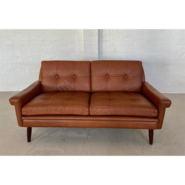 Crafted in Denmark by Skipper Furniture, this exquisite Danish 2-person sofa boasts a sleek design and luxurious comfort....