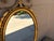 Early 20th Century Adam Style Neoclassical Giltwood Oval Mirror With Urn Crest For Sale In South Bend - Image 6 of 17
