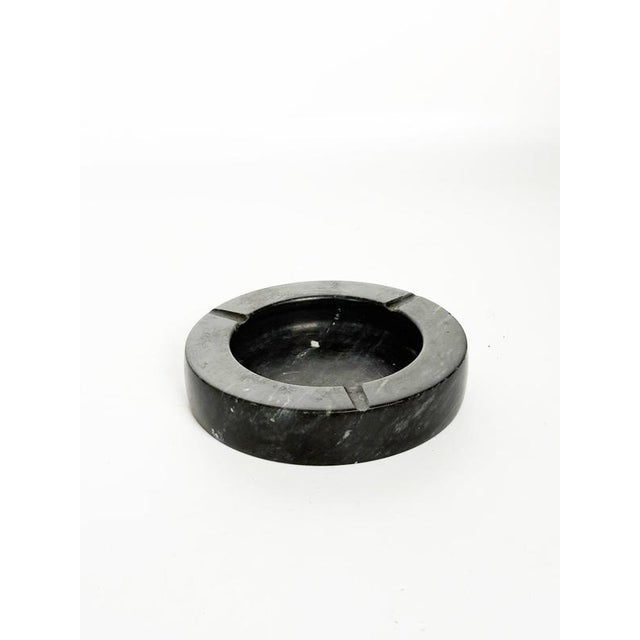 Decorative French black marble ashtray dating from the 1970s, characterized by a simple circular form and a substantial,...