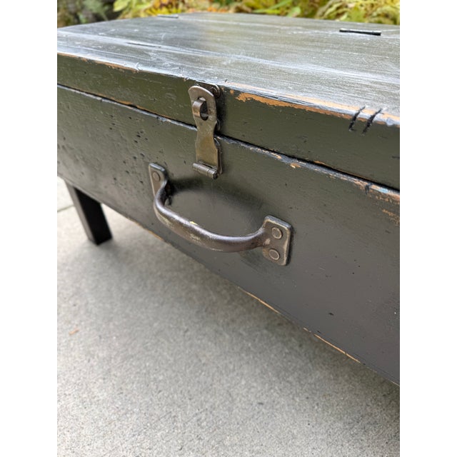 Offering a drenched-in-character low-profile bench with hinged lid for storage. Marks, nicks, scuffs with aged paint...