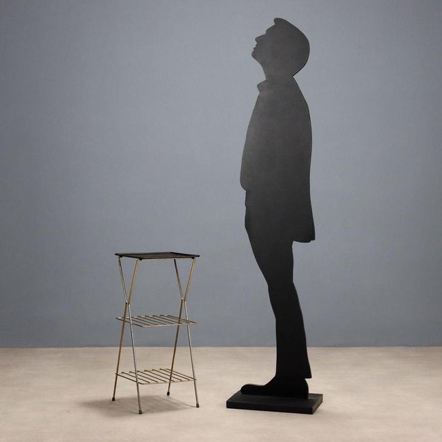 Etagere, enameled metal, and brass. This piece is attributed to the mentioned designer/maker. It has no attribution mark...