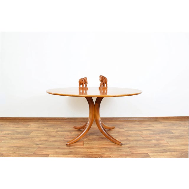 This high-quality table was produced in Germany in the 1960s by Alma. The table is made of walnut wood. The furniture is...