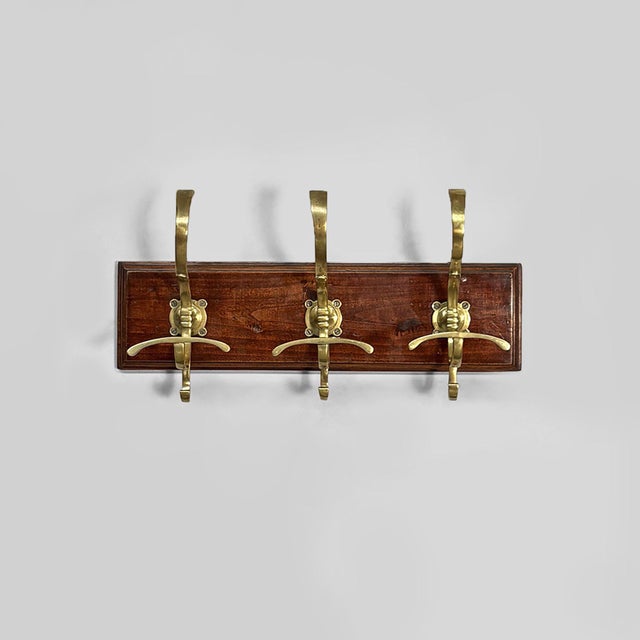 Italian Art Nouveau wall coat rack in wood and brass, 1920s Wall coat rack with three brass S-hooks. Rectangular wooden...