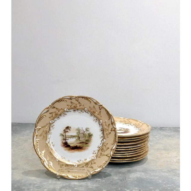 An early 19th-century English part dessert set, circa 1825, possibly Ridgway. This set is decorated with different country...