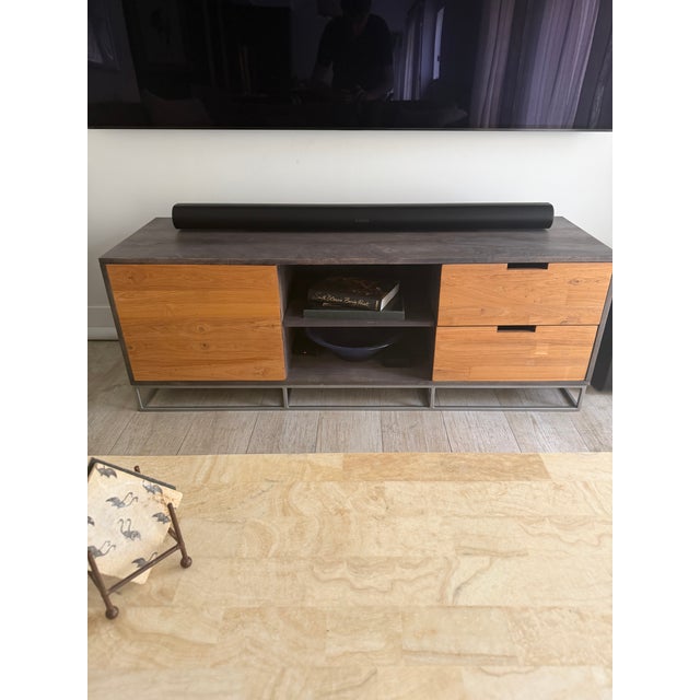 2010's CB2 "Congo" media console in great condition--no watermarks or scratches. Mixed color woods offer an interesting...