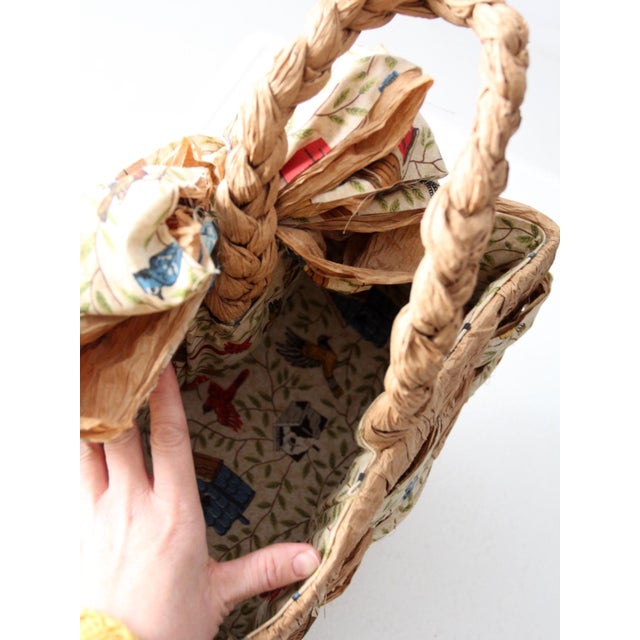 This handcrafted vintage woven tote is made from woven paper and accented with a charming sweet bird–print fabric....