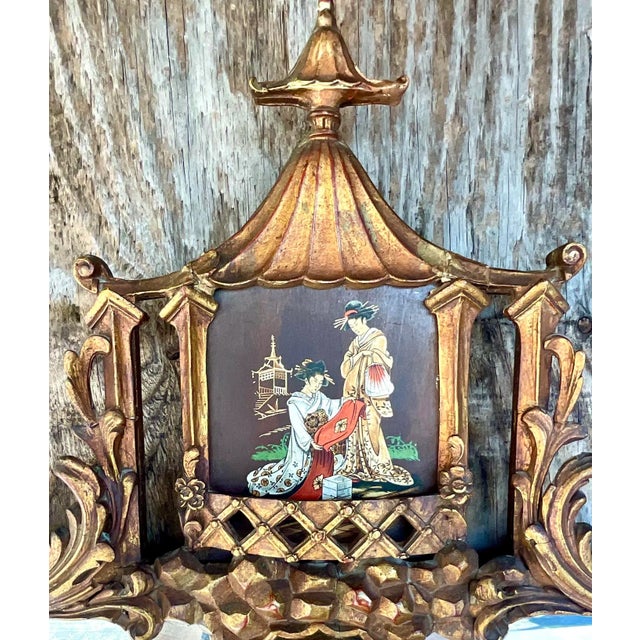Incredible vintage hand carved Mirror. The coveted Pagoda style with a beautiful hand painted Chinoiserie scene across the...