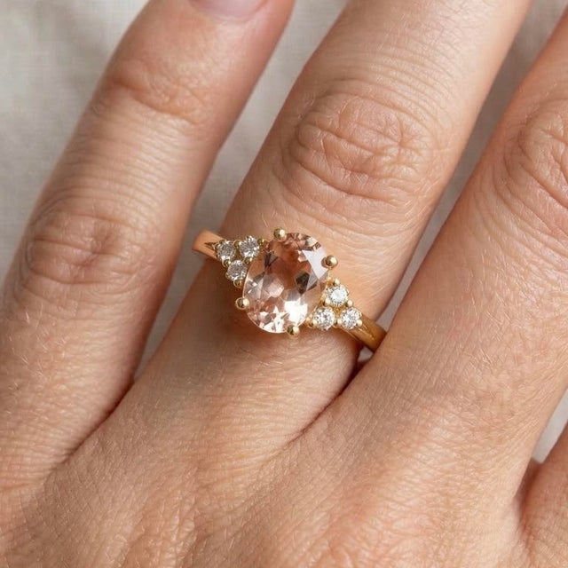 Graceful and romantic, this exquisite ring features a captivating Morganite gemstone, beautifully set in a timeless design...