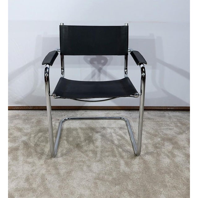 Black leather armchair using Marcel Breuer's B34 model published in the 1930s. This seated seat has a chrome metal tubular...