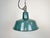 Industrial green enamel pendant light made by Polam Wilkasy in Poland during the 1960s. White enamel inside the shade....