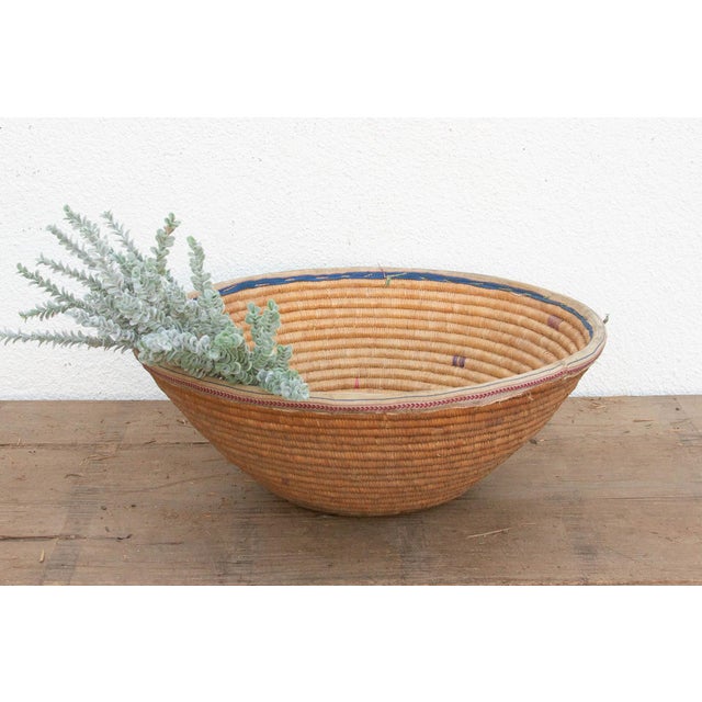 This 22-inch nomadic harvest vessel is a beautiful study in cultural adaptation and functional longevity. Originally hand-...