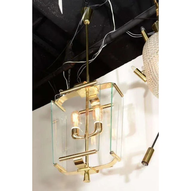 Italian Art Deco lantern with cast brass parts, two lights and four rounded edge glass panels, circa 1930. Each glass...