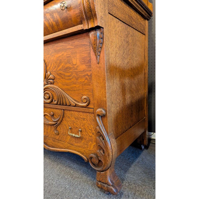 Impressive American quarter sawn oak Sideboard with carvings abound and stately Empire Scroll upper supports with claw...