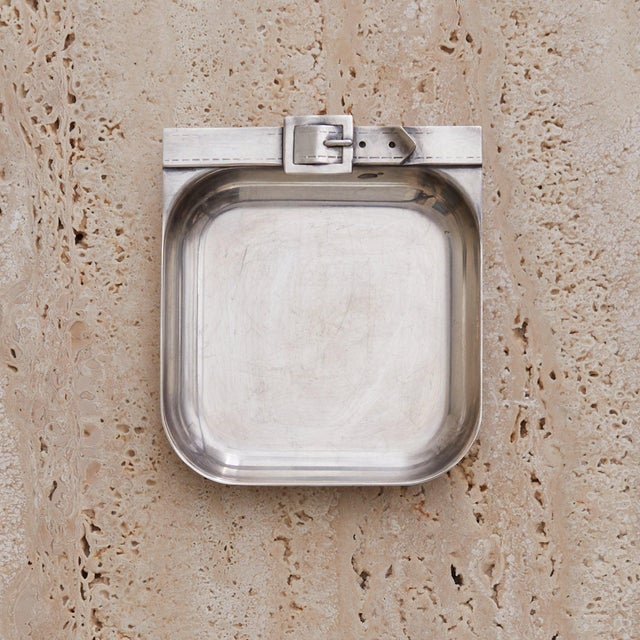A silver-plated vide poche by Maria Pergay, circa 1960s. Sculpted in brass with a high polish and soft curves, the form is...