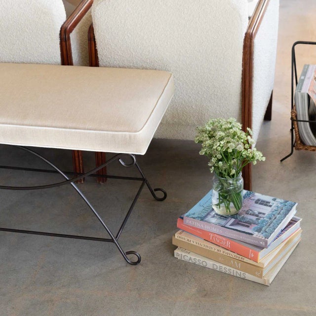 Beautiful iron bench with curved and looped base painted in a matte black finish inspired by French design. Rectangular...